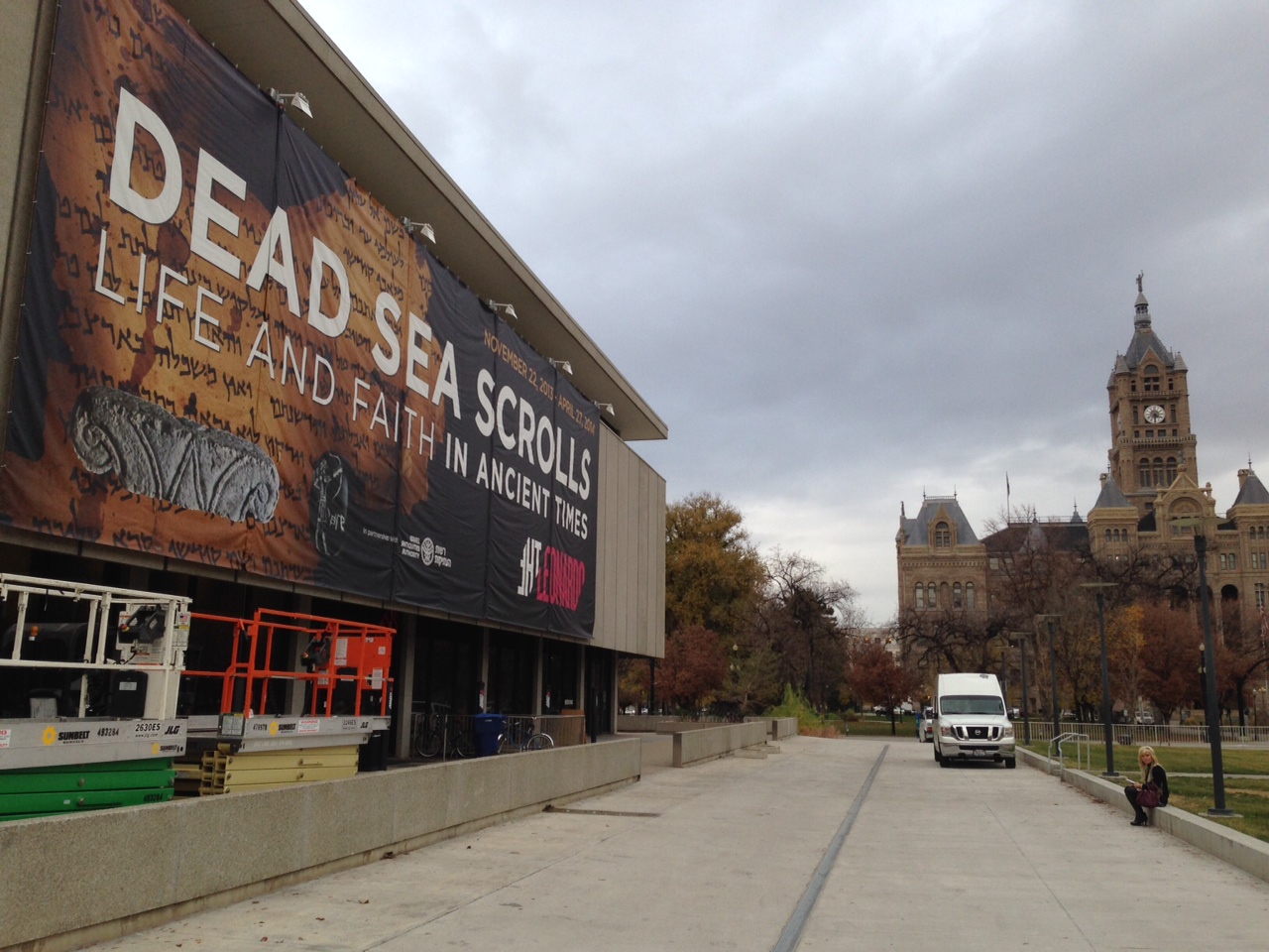 An exhibition of Dead Sea scrolls and other artifacts is advertised on a banner draping The Leonardo in Salt Lake City.