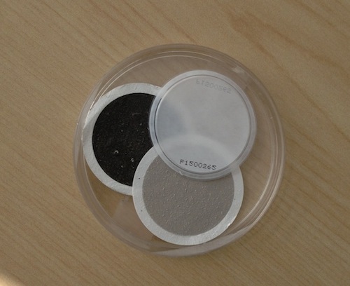 Test filter for air quality: unused (white), normal day (grey), red air day (black)
