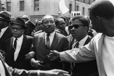 Martin Luther King Jr. is jostled in Memphis as the march he's leading on March 28, 1968 turns violent. Photo courtesy University of Memphis Libraries.