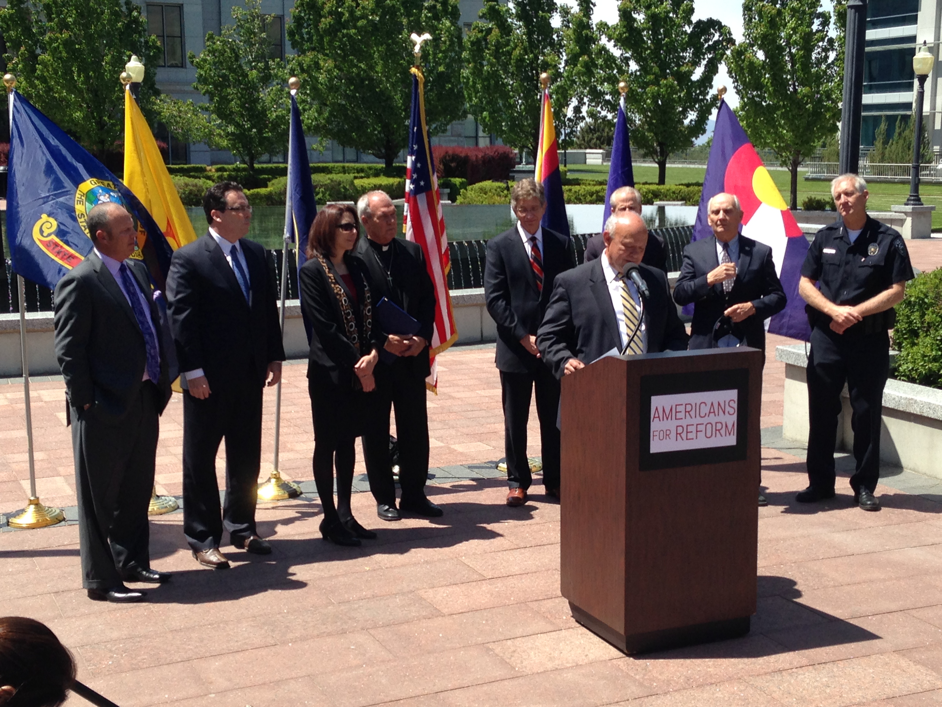 Lane Beattie, President and CEO of the Salt Lake Chamber of Commerce, speaks in front a coalition of Utah leaders in support of immigration reform on May 13, 2014.