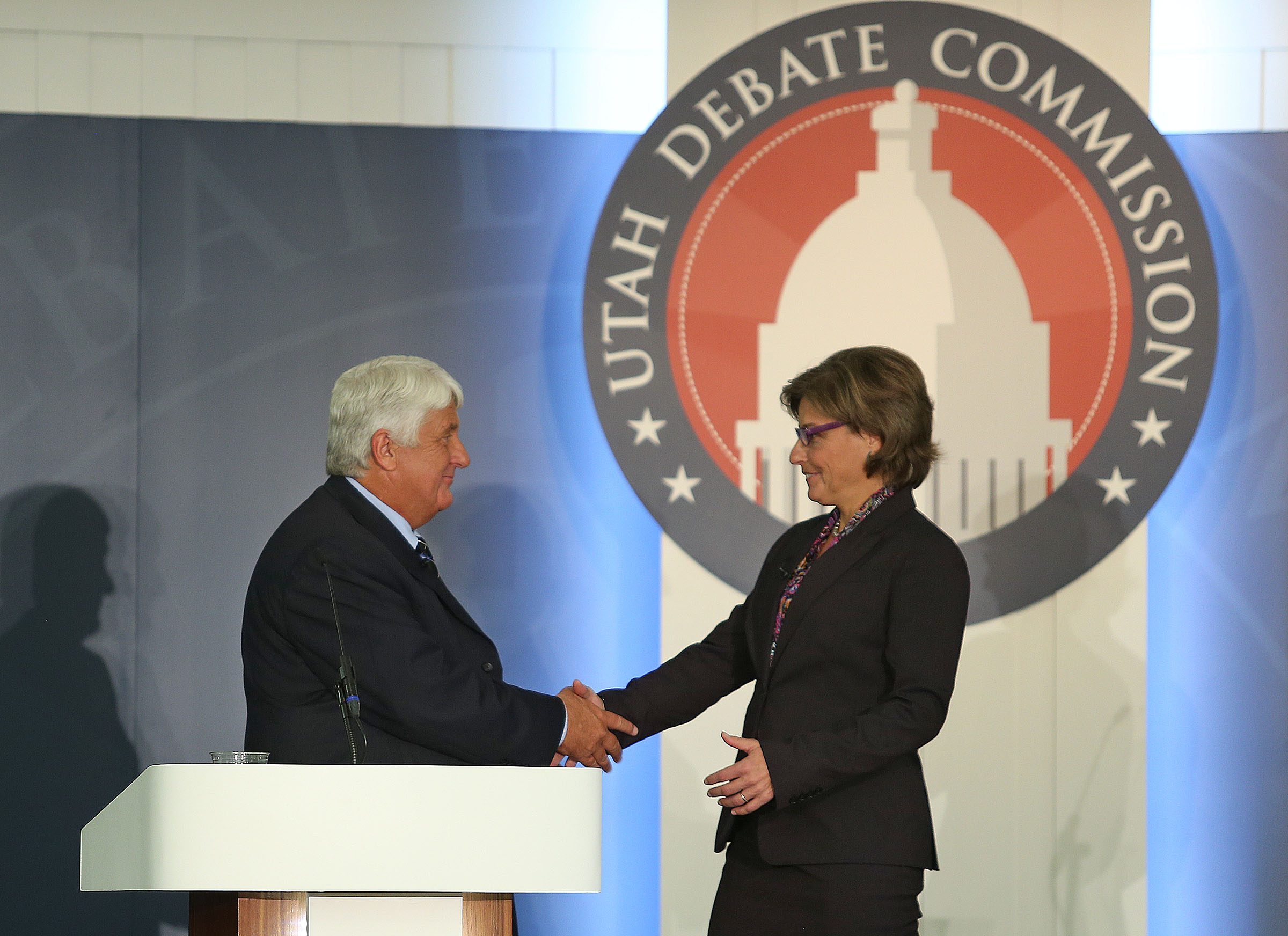 Republican Rep. Rob Bishop and Democratic challenger Donna McAleer greet each other at a debate in Ogden, Utah, on September 23, 2014.